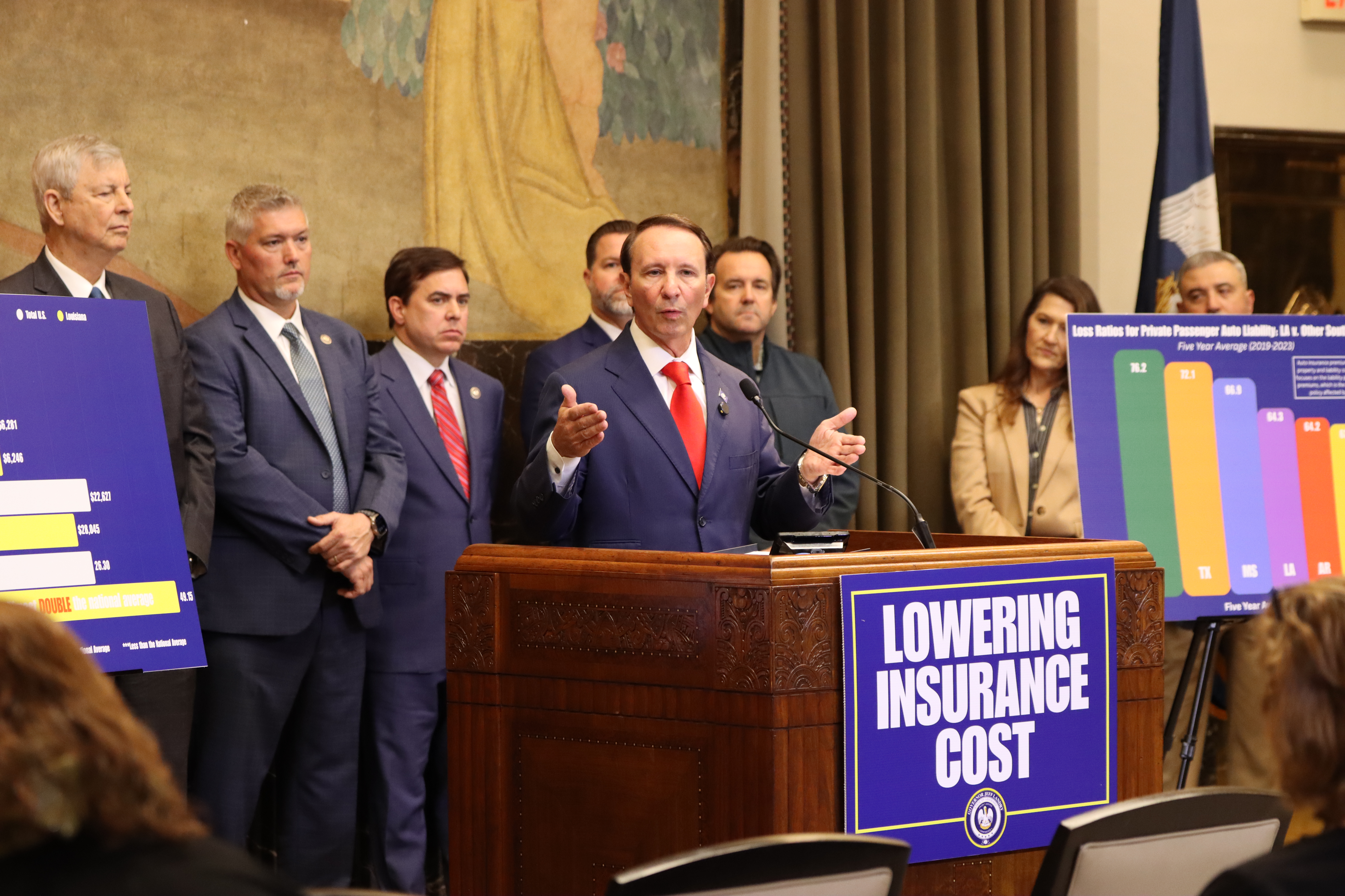 Photograph of Governor Landry speaking at a press conference